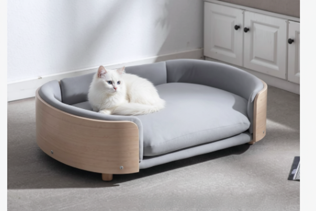 White cat in original wooden sofa pet bed
